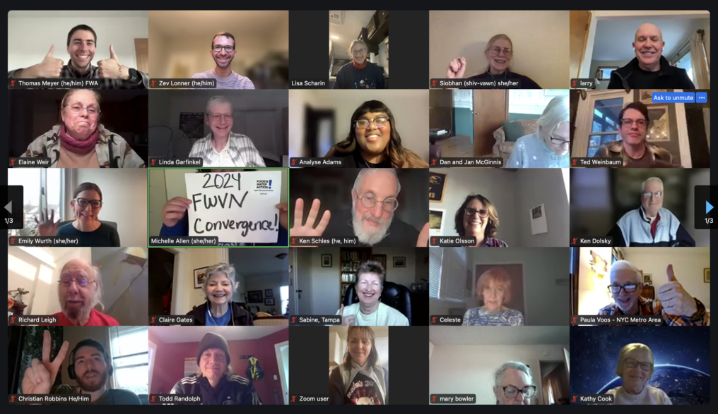 A screenshot showing a zoom grid of 25 people's screens, with food & water volunteers smiling and making peace signs and thumbs up at the camera.